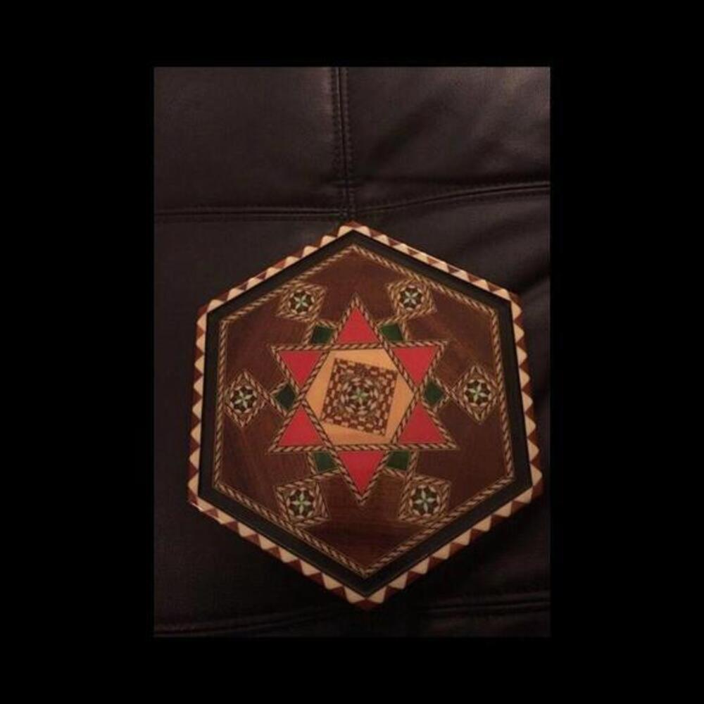 Beautiful vintage wooden hexagon board with inlaid mosiac pattern‎